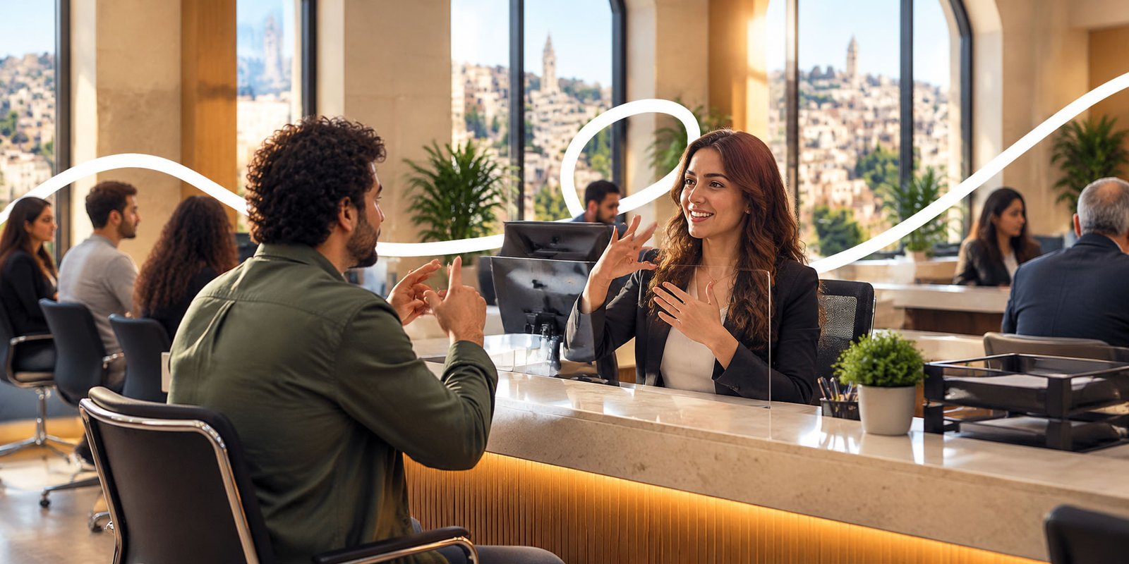 A receptionist and a visitor signing across a reception desk